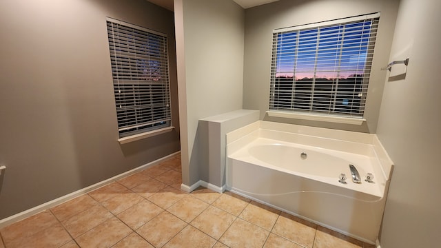 bathroom featuring tile patterned floors and a washtub