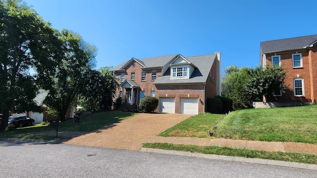 view of front facade featuring a garage and a front yard