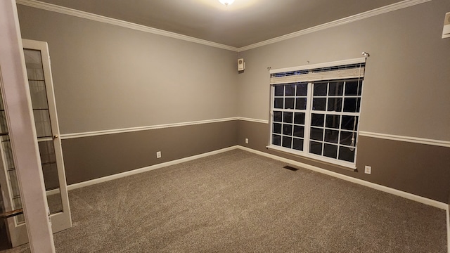 carpeted spare room with crown molding