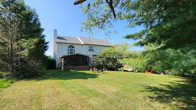 view of yard featuring a sunroom