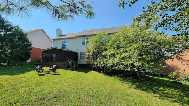 view of yard featuring a sunroom