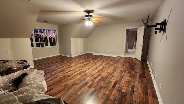 bonus room with dark hardwood / wood-style floors, vaulted ceiling, and ceiling fan