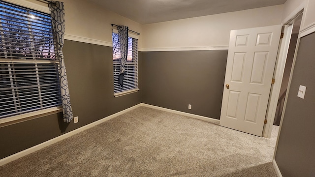 unfurnished bedroom featuring carpet