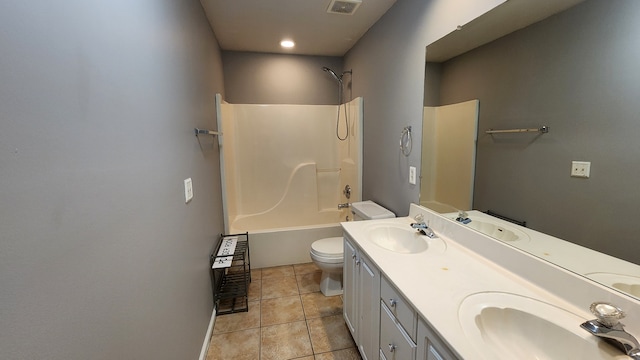 full bathroom with tile patterned floors, vanity, toilet, and washtub / shower combination