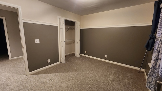 unfurnished bedroom with carpet and a closet