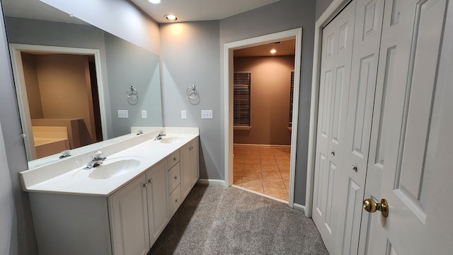 bathroom with tile patterned flooring and vanity