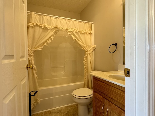 full bathroom with shower / bath combo, tile patterned floors, a textured ceiling, toilet, and vanity