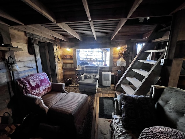 basement featuring wooden walls