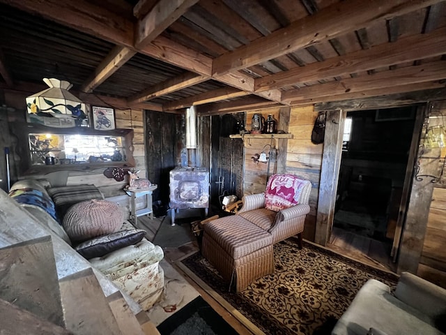 interior space featuring beamed ceiling and wood walls