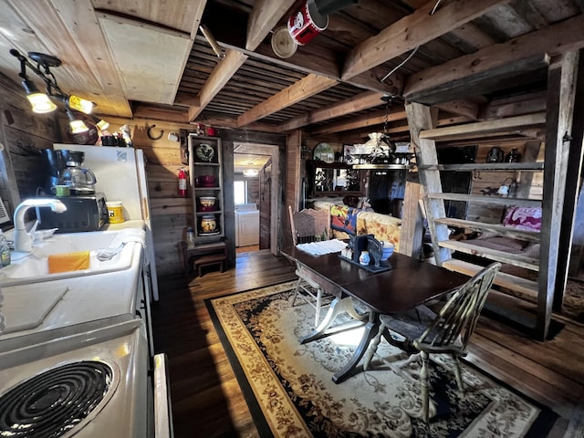 kitchen with dark hardwood / wood-style flooring, sink, wood ceiling, and wood walls