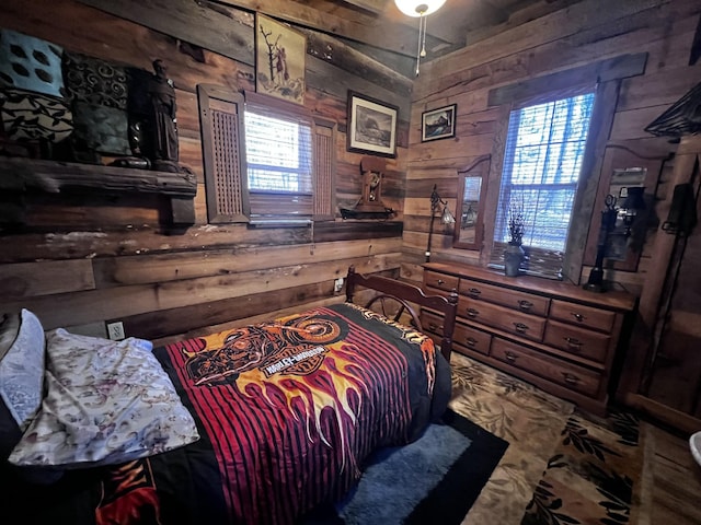 bedroom featuring rustic walls