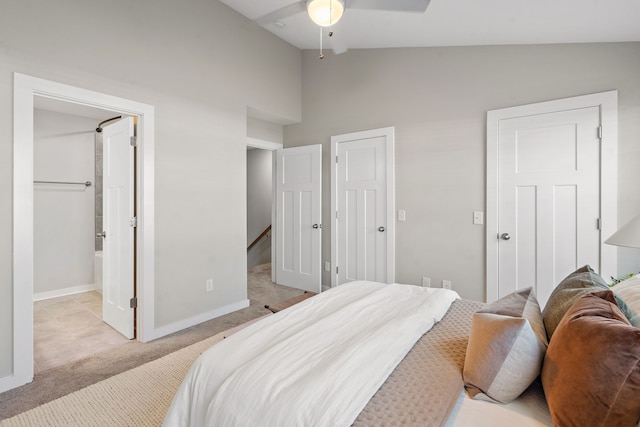 bedroom featuring light carpet, vaulted ceiling, and ceiling fan