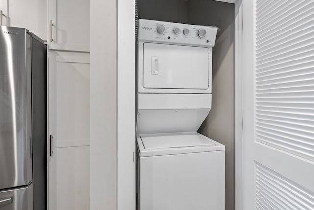 laundry area with stacked washer / dryer