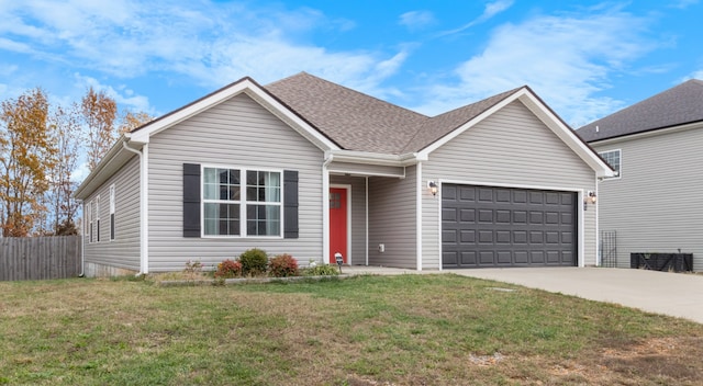 view of front of home featuring a garage and a front lawn