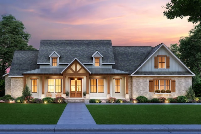 view of front facade with a porch and a yard