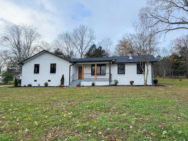 view of front of property with covered porch and a front lawn