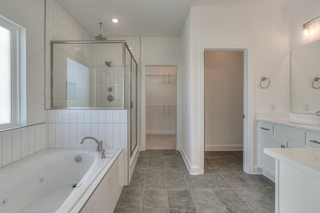 bathroom featuring vanity and separate shower and tub