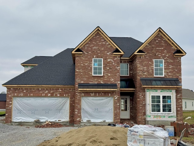 view of front of property featuring a garage