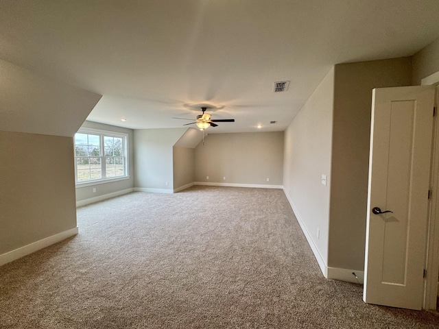 bonus room with a ceiling fan, carpet, visible vents, and baseboards