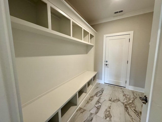 mudroom with marble finish floor, baseboards, visible vents, and ornamental molding