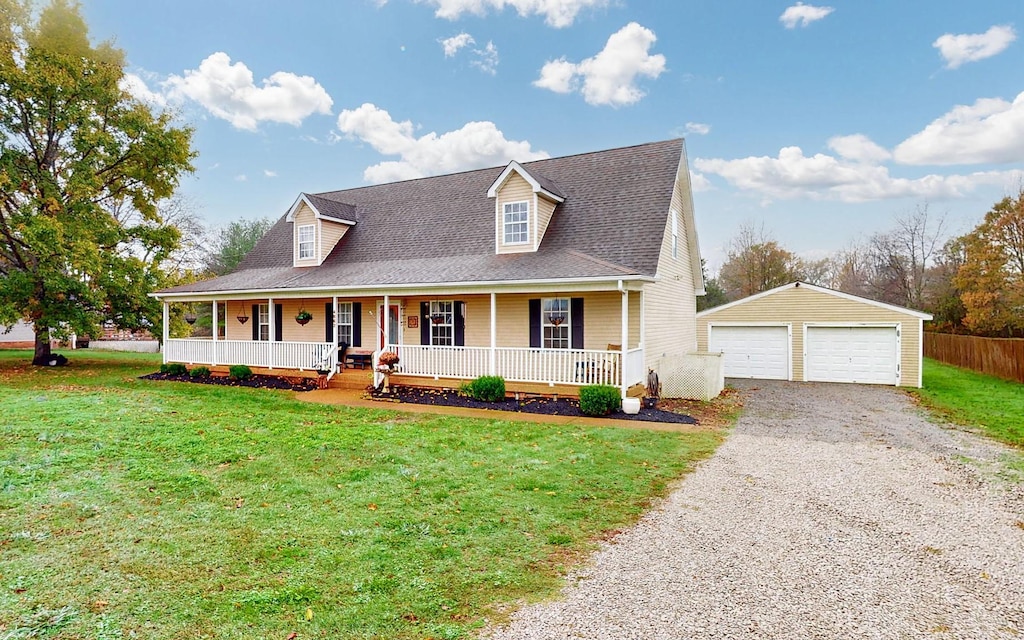 cape cod home with an outbuilding, a front yard, a porch, and a garage