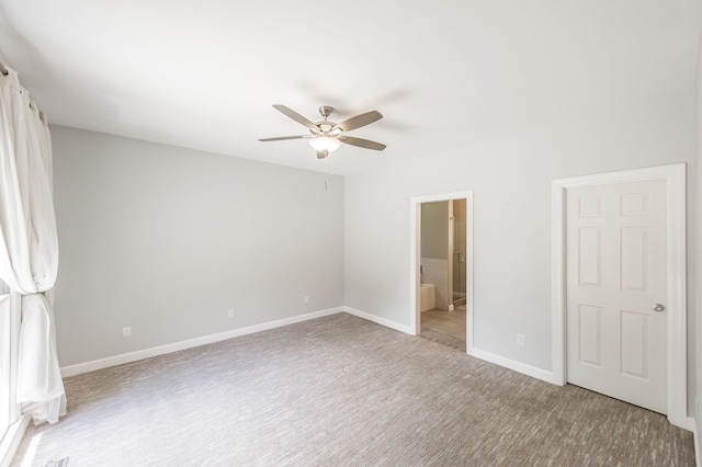 unfurnished bedroom featuring ensuite bath and ceiling fan