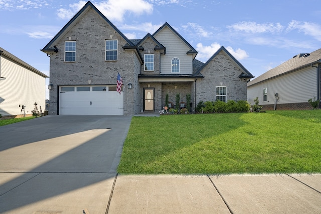 view of front of house with a garage and a front yard