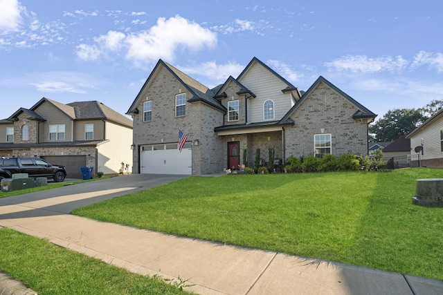 view of front of house with a garage and a front lawn