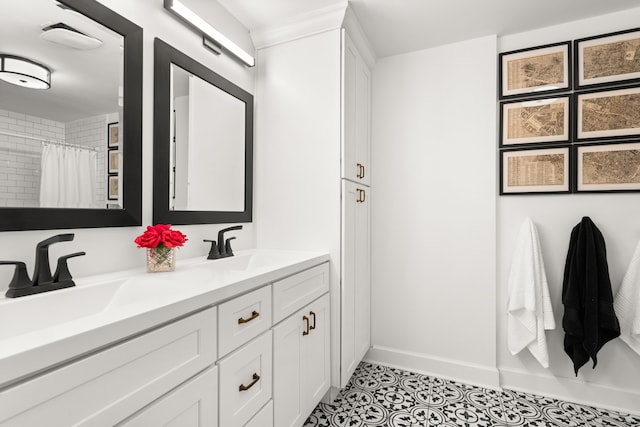 bathroom with a shower with curtain, tile patterned flooring, and vanity