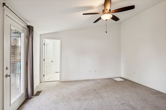 carpeted empty room with ceiling fan and lofted ceiling