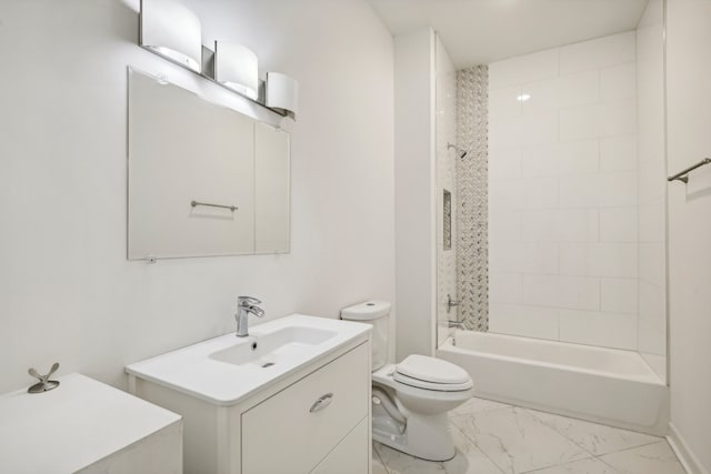 full bathroom with vanity, tiled shower / bath combo, and toilet