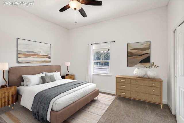 carpeted bedroom with ceiling fan