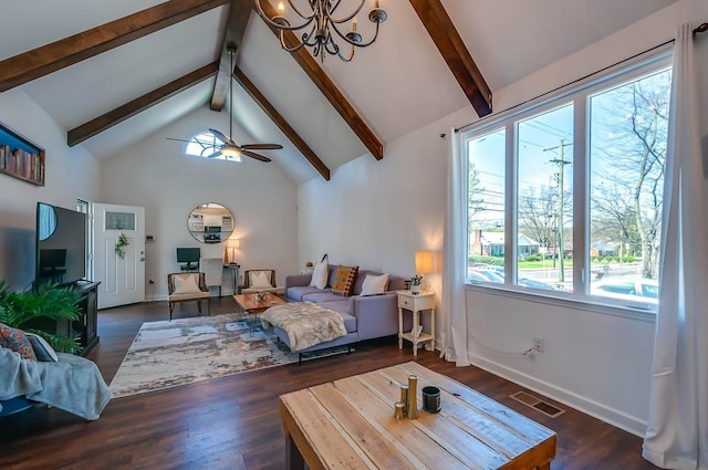 bedroom featuring beamed ceiling, dark wood-type flooring, and multiple windows