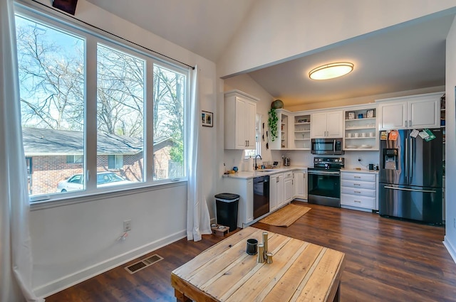 kitchen with dark hardwood / wood-style flooring, sink, black appliances, white cabinetry, and lofted ceiling