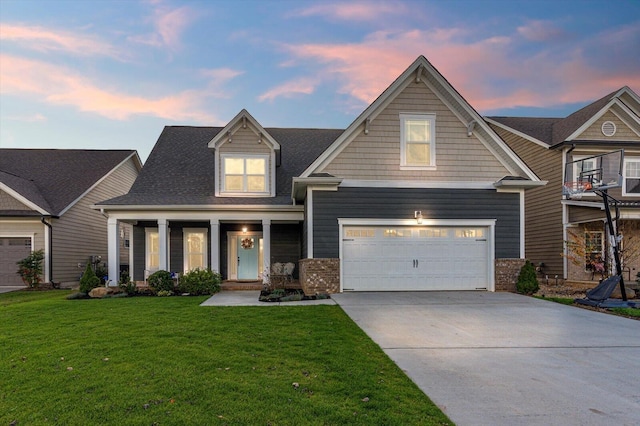 craftsman inspired home with a lawn and a garage