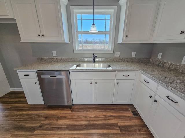 kitchen with pendant lighting, sink, white cabinetry, dark hardwood / wood-style floors, and stainless steel dishwasher