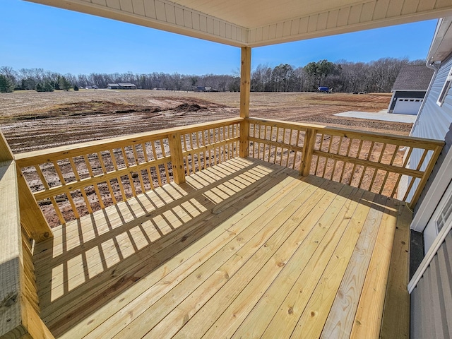 wooden terrace with a rural view