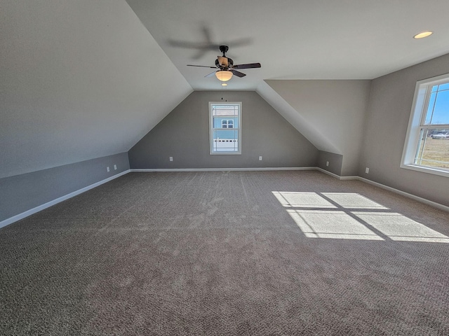 additional living space featuring ceiling fan, carpet flooring, and vaulted ceiling