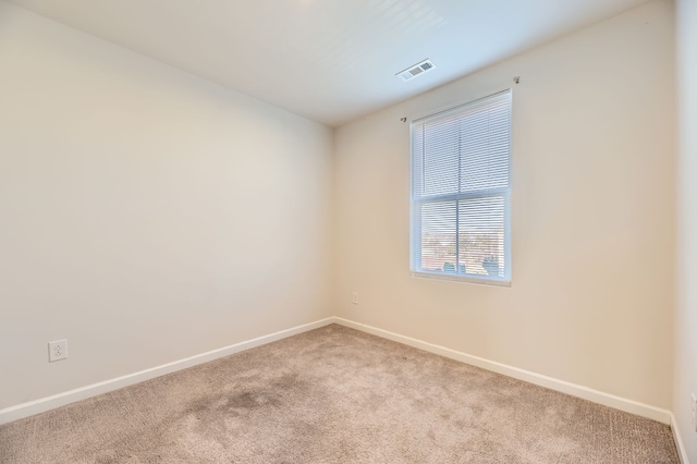 unfurnished room with carpet floors