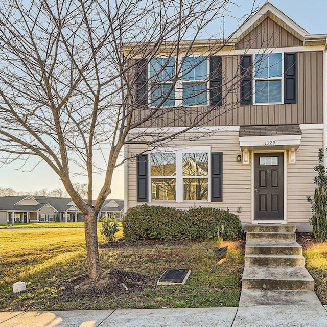 view of front of property featuring entry steps and board and batten siding