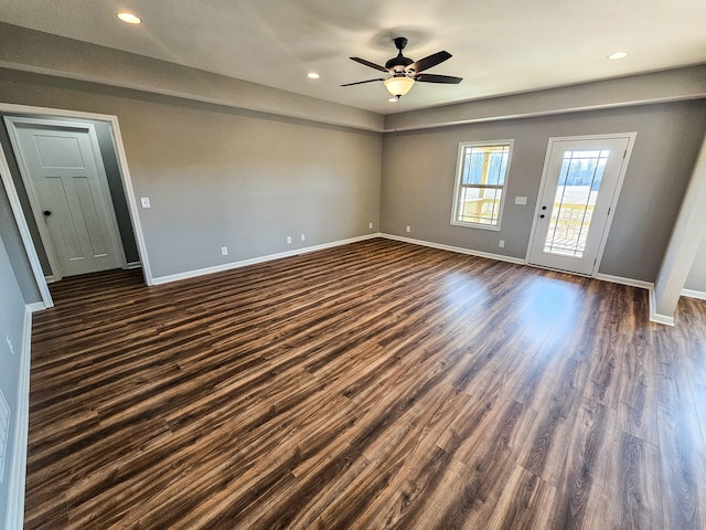 spare room featuring ceiling fan and dark hardwood / wood-style floors