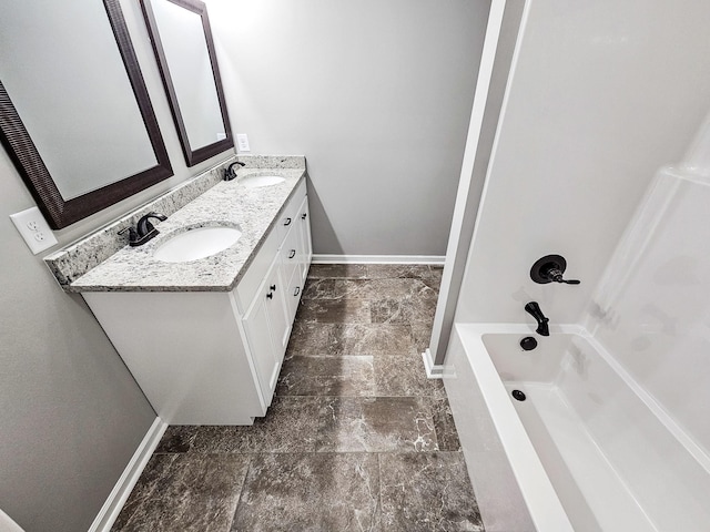 bathroom featuring vanity and shower / bathing tub combination