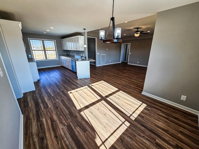 kitchen featuring white cabinets, dark hardwood / wood-style flooring, and decorative light fixtures