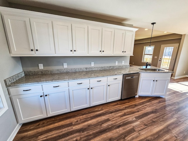 kitchen featuring sink, white cabinetry, hanging light fixtures, dark hardwood / wood-style floors, and dishwasher