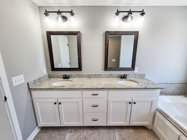 bathroom with vanity and a washtub