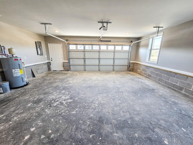 garage featuring water heater, a garage door opener, and electric panel