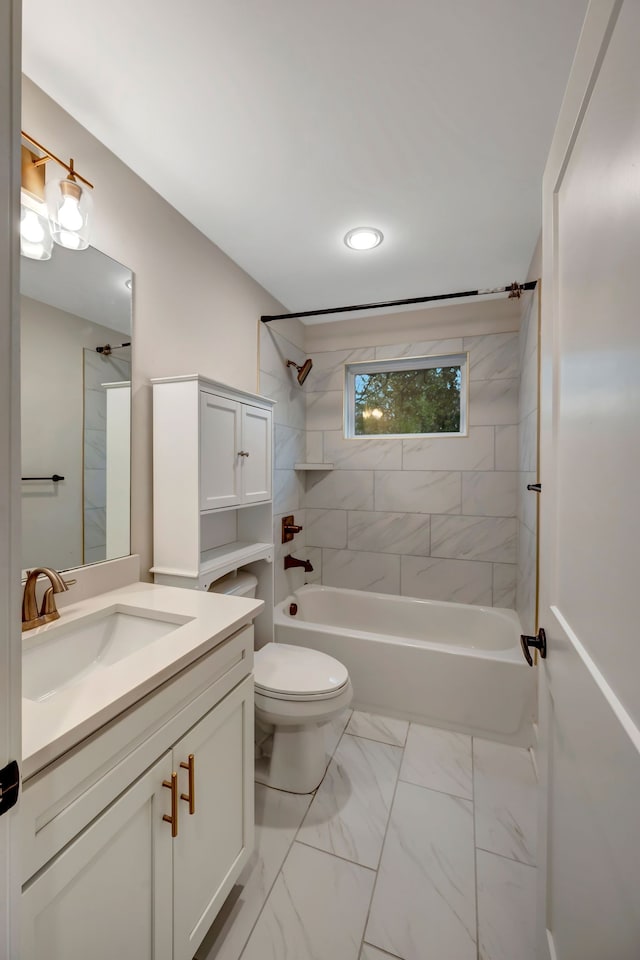 full bath with toilet, marble finish floor, washtub / shower combination, and vanity