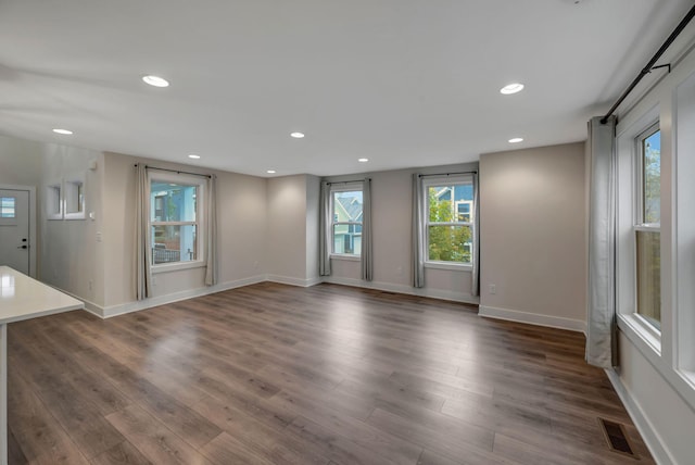 1410 Riverside Dr Unit A, Nashville, TN 37206 - unfurnished living room with recessed lighting, dark wood-style floors, and baseboards