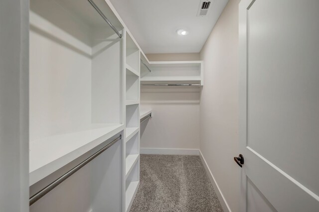 spacious closet with visible vents and carpet flooring