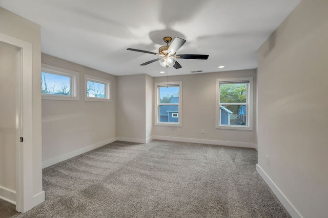 empty room featuring recessed lighting, visible vents, carpet flooring, ceiling fan, and baseboards